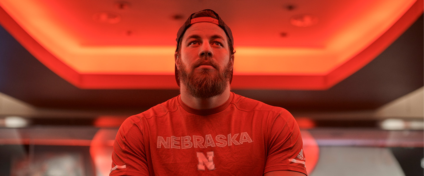 Football player and former U.S. Navy Seal Damian Jackson pursues his dream as a Nebraska Cornhusker in the weight room
