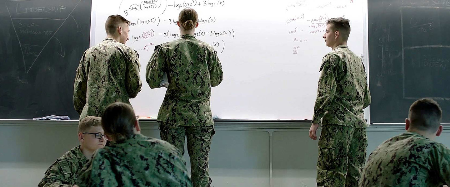 United States Navy Nuclear Propulsion Officer Candidates work advanced math equations with a NUPOC Instructor at the Navy’s Nuclear Power School.