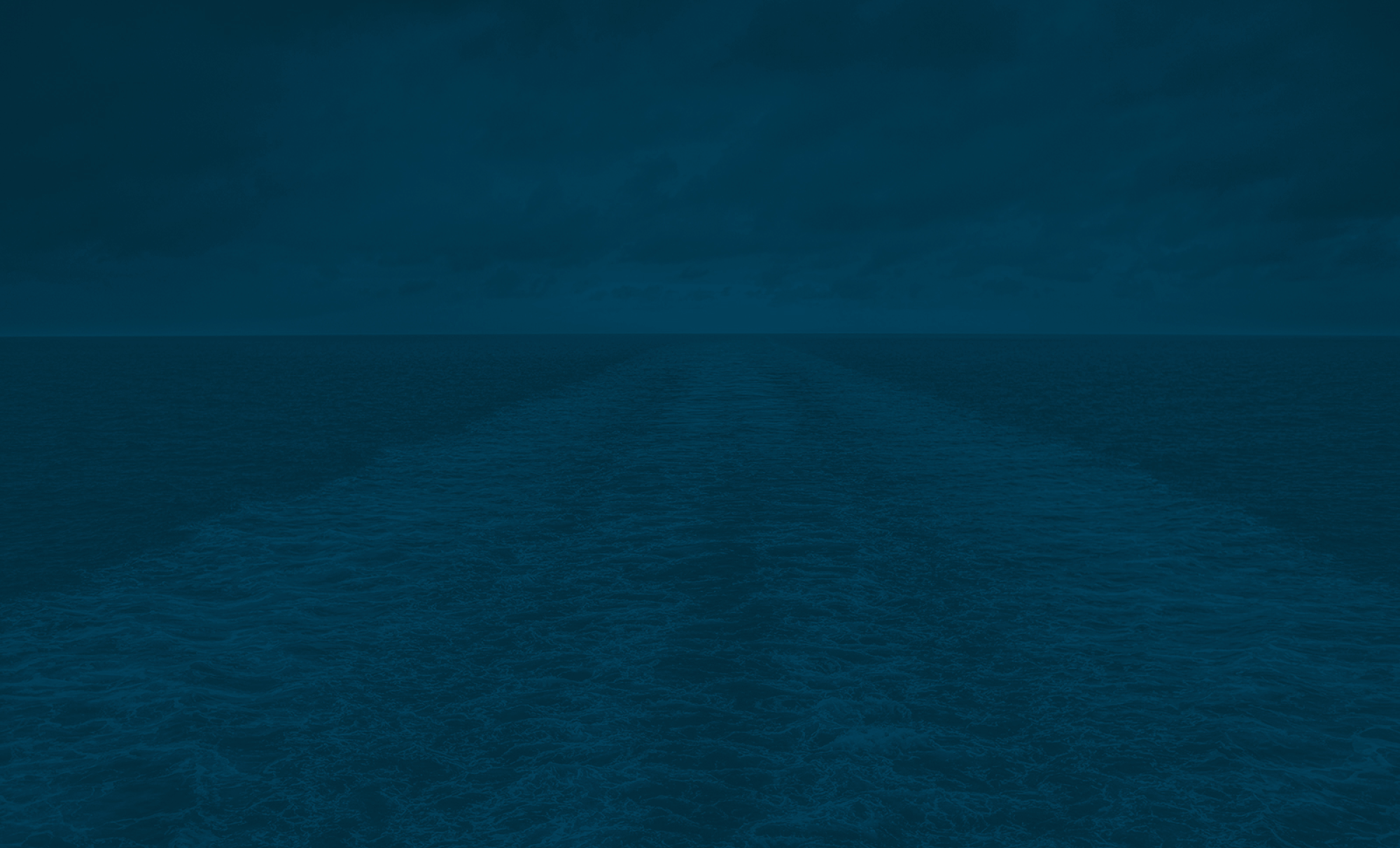 A dark blue ocean with limited wake.