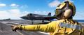 United States Navy Aviation Boatswain’s Mates inspect a launch catapult on an aircraft carrier.
