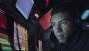 A Navy technology specialist monitors navigation equipment aboard a United States Navy vessel.